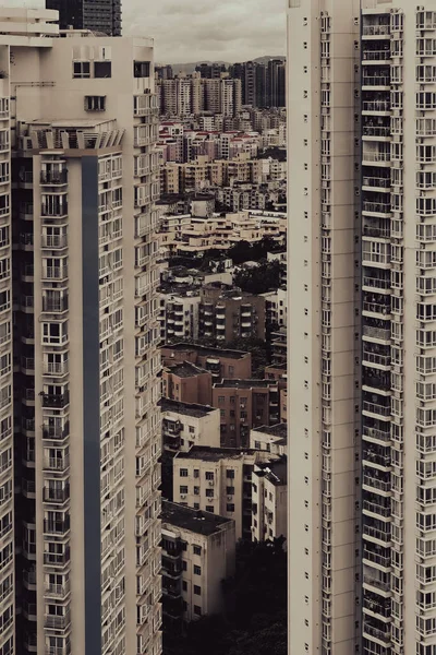 Vertical Shot Two High Rise Buildings Other Small Ones Background — Stock Photo, Image