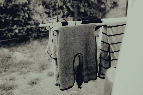 Grayscale Shot Wetsuits Drying Surf — Stock Photo, Image