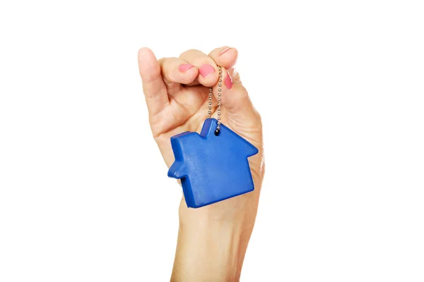 Closeup Shot Female Hand Holding Blue Small House Keychain Isolated — Stockfoto