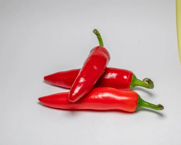 Closeup Shot Three Red Chili Peppers White Background — Stock Photo, Image