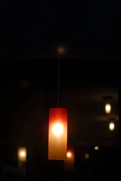 Vertical Closeup Shot Lighted Hanging Lamp Others Background Dark — Stock Photo, Image