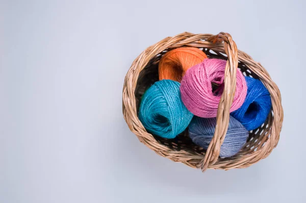 Pile Colorful Textile Balls Wool Wicker Basket Blue Background Copy — Stock Photo, Image