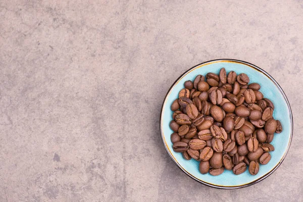 Biji Kopi Panggang Dengan Latar Belakang Bertekstur Coklat Ruang Kosong — Stok Foto