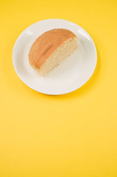 Vertical Shot Half Bread Yellow Background — Stock Photo, Image