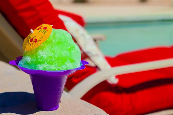 A colorful shave ice near the pool