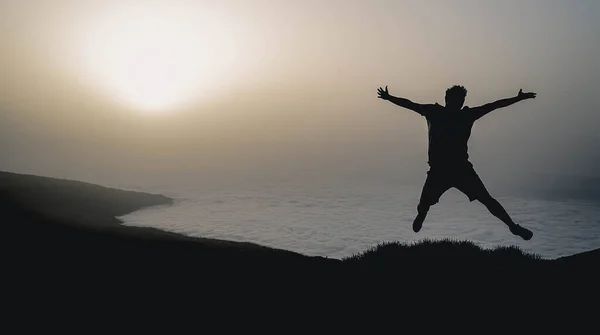 Silhouette Man Jumping Sunset View Background — Stock Photo, Image