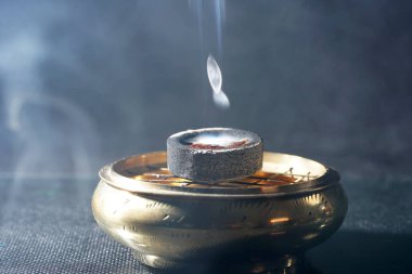 A closeup shot of smoke coming from an incense bowl clipart