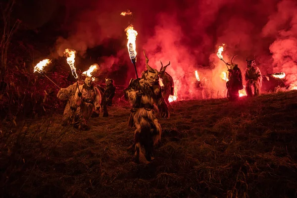 The Beltane Gaelic May Day festival with people with torches on the field