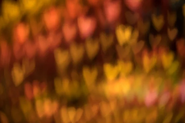 Ein Orangefarbener Hintergrund Mit Verschwommenem Herzlicht — Stockfoto