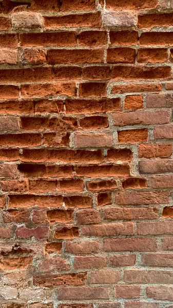 Вертикальный Снимок Оранжевой Кирпичной Стены — стоковое фото