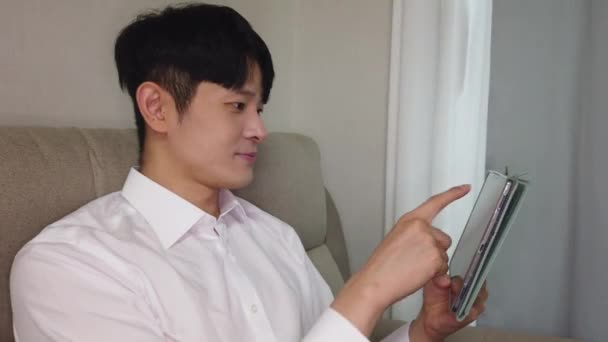 Footage Handsome Young Asian Man Using Digital Tablet Home — Vídeo de Stock