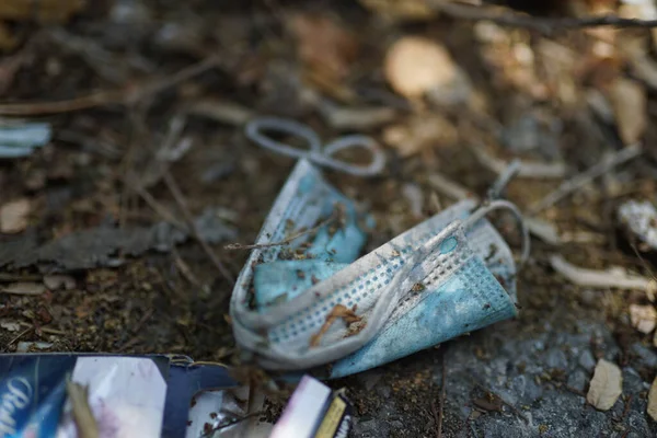 Closeup Shot Dirty Folded Medical Facemask Thrown Ground — Stock Photo, Image