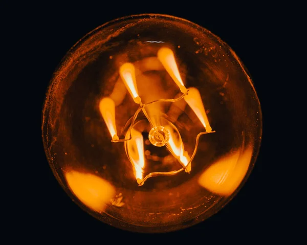 Closeup Lit Light Bulb Black Background — Stock Photo, Image
