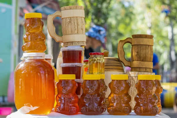 Table Glass Jars Wooden Barrels Plastic Containers Filled Bee Honey — Stock Photo, Image