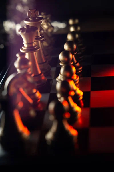 Horizontal shot of cool silver chess pieces in the starting position  reflected on the board Stock Photo by wirestock