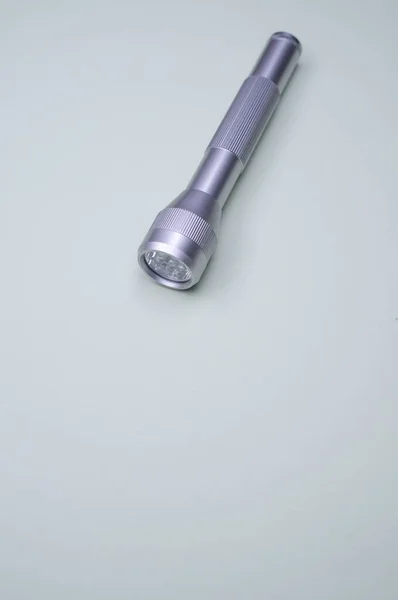 Vertical Closeup Metallic Flashlight Gray Background — Stock Photo, Image