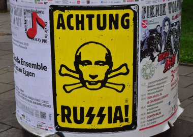 KRAKOW, POLAND - Aug 12, 2014: A satirical anti-russian poster in the Polish city of Krakow clipart