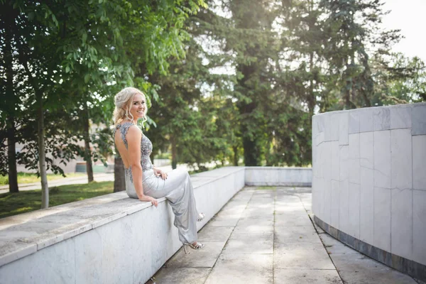 Pretty Young Woman Sitting Bench Silver Dress Open Back — Stok fotoğraf