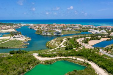 A landscape of a resort area in Cap Cana surrounded by the sea in the Dominican Republic clipart