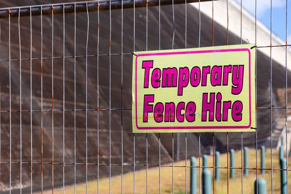 Corrugated plastic sign on temporary fence at Tinaroo Falls Dam in Queensland, Australia