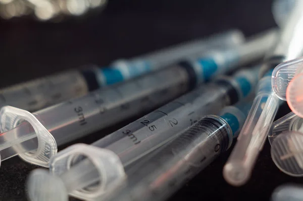 A closeup shot of syringes and hypodermic needles