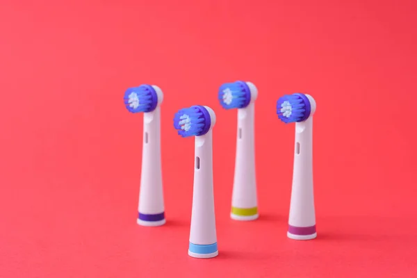 Bunch New Electric Toothbrush Heads Red Background — Stock Photo, Image