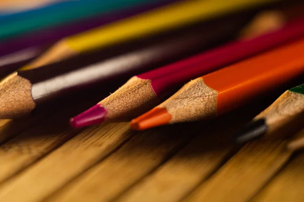 High Angle Shot Sharpened Color Pencils Wooden Surface Spotlight — Stock Photo, Image