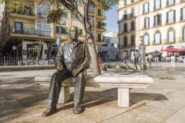 MALAGA, SPAIN - Jan 30, 2020: The bronze statue of Pablo Picasso at Mercy Square, Malaga, Andalucia, Spain clipart