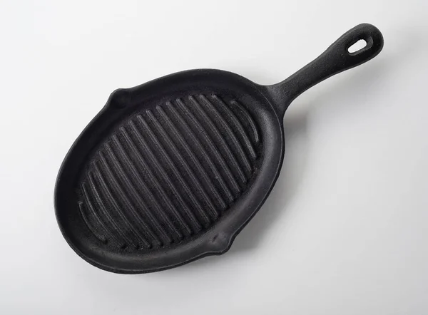 Top View Empty Oval Shaped Black Iron Grill Skillet White — Stock Photo, Image