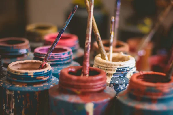 Closeup Plastic Cups Paint Brushes — Stock Photo, Image