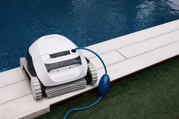 During his employment as a pool cleaner. The botton of swimming pools is cleaned by a cleaning robot. Pool cleaners that clean themselves.