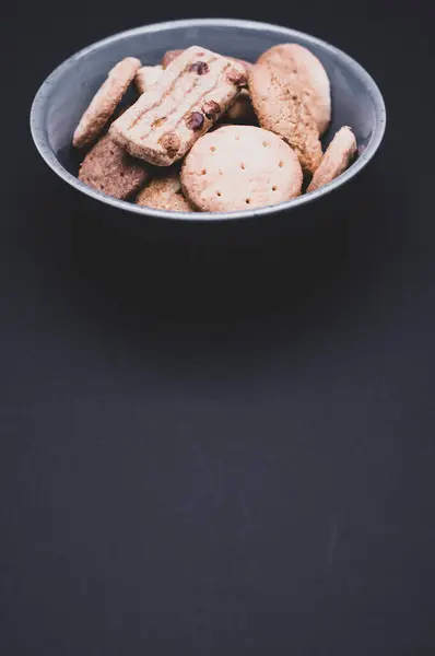 Closeup Tasty Sweet Small Biscuits Bowl Black Surface — Stock Photo, Image