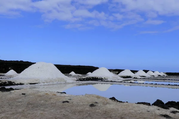 Production of natural crystals of salt from sea water.