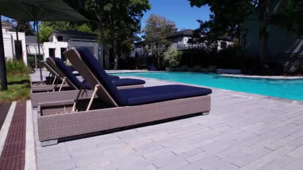 Swimming Pool Umbrella Chairs — Stock Video