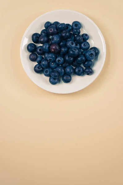 Top View Sweet Tasty Blueberries Plate Yellow Surface — Stock Photo, Image