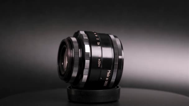 Close View Camera Lens Rotating Dark Background — Stock Video