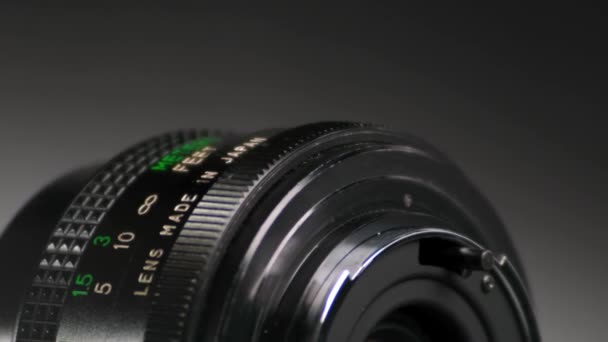 Close View Camera Lens Rotating Dark Background — Stock Video