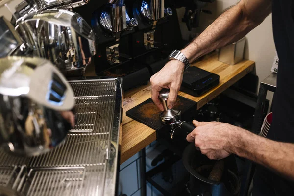 Closeup Shot Bartender Hands Pressing Ground Coffee Portafilter — Stock Photo, Image