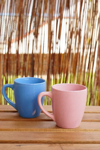 Vertical Shot Pink Blue Tea Cups Side Side Wooden Table — Stock Photo, Image