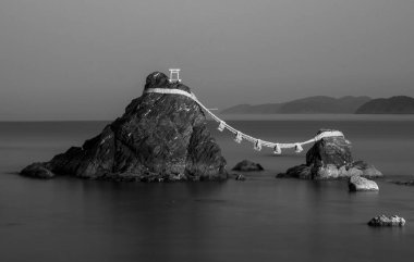 The famous Meoto Iwa or the Married Couple Rocks, two rocky stacks in the sea off Futami, Mie, Japan clipart