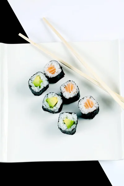 Closeup Sushi Rolls White Plate Wooden Sticks — Stock Photo, Image