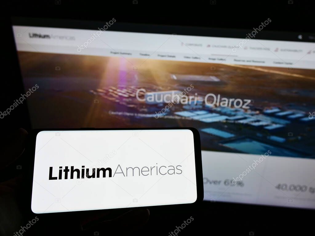 STUTTGART, GERMANY - Jun 22, 2021: Person holding cellphone with logo of Canadian company Lithium Americas Corp. on screen in front of business webpage. Focus on phone display.