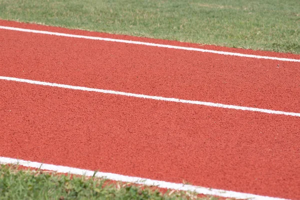 Close Van Een Hardloopbaan Met Witte Lijn Gebruiken Als Achtergrond — Stockfoto