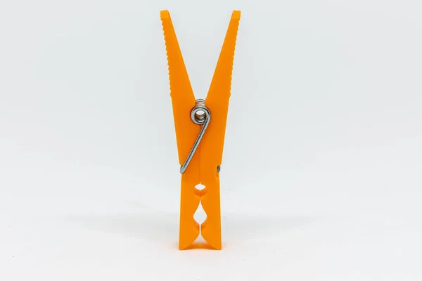 Closeup Orange Plastic Clothespin White Background — Stock Photo, Image