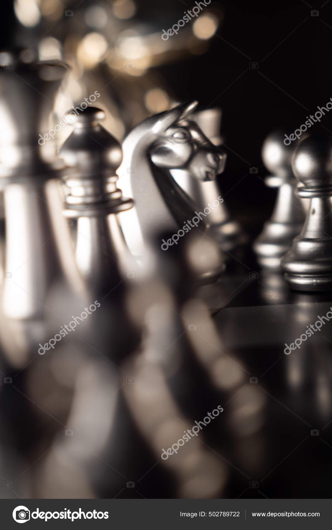 Horizontal shot of cool silver chess pieces in the starting position  reflected on the board Stock Photo by wirestock