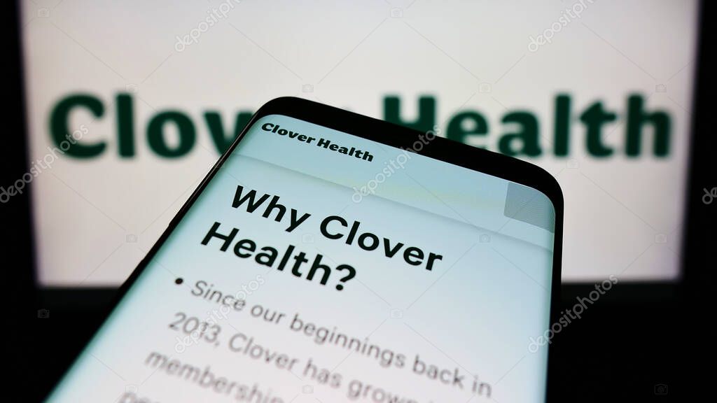 STUTTGART, GERMANY - Aug 16, 2021: Mobile phone with website of healthcare company Clover Health Investments Corp. on screen in front of logo. Focus on top-left of phone display.