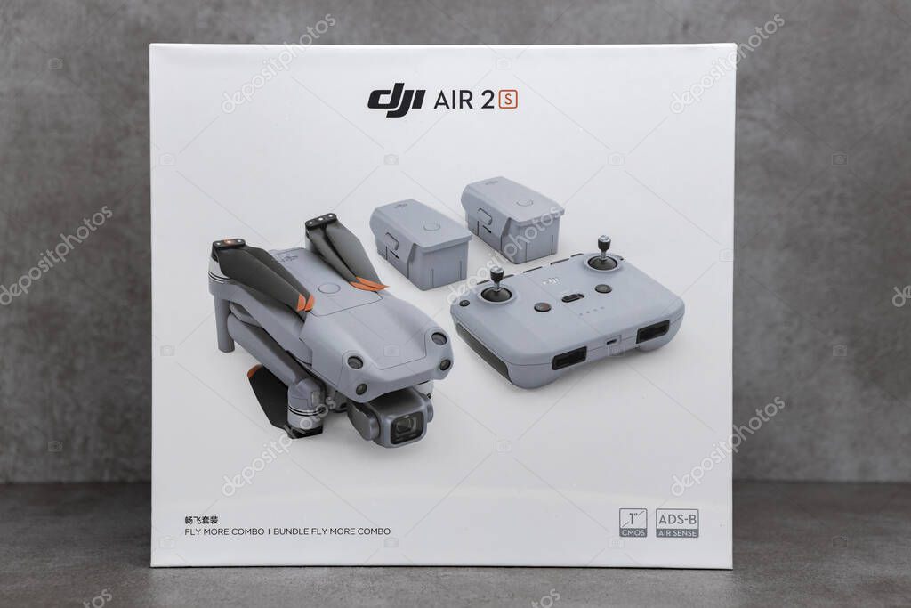ZUTPHEN, NETHERLANDS - Aug 06, 2021: RPS product still life of DJI fly more combo package box portable quadcopter Air 2S drone on stylish contemporary modern metallic patterned back