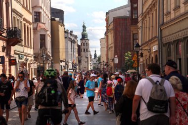 CRACOW, POLAND - Aug 09, 2021: Cracow, Malopolska, Poland - 08.09.2021:  The crowd of tourists on Grodzka Street. Called Kings Road Grodzka leads from Main Market place to Wawel. clipart
