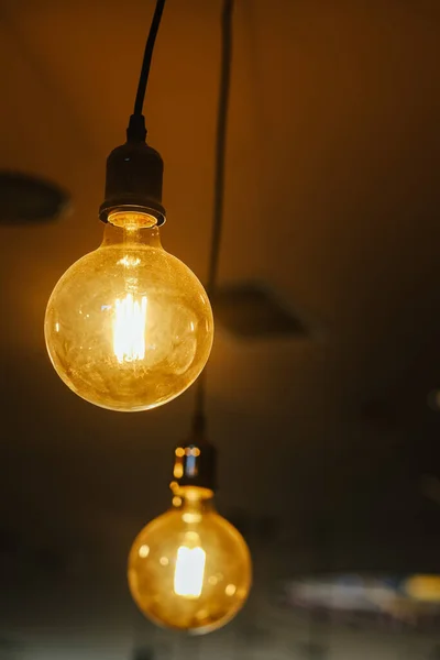 Vertical Closeup Shot Two Light Bulbs Hanging Ceiling — Stock Photo, Image