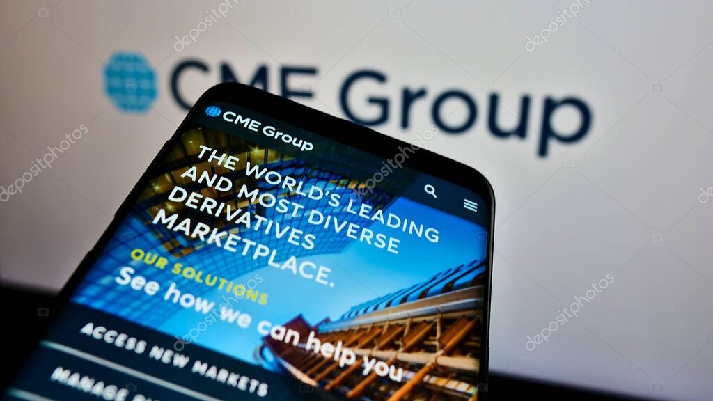 STUTTGART, GERMANY - Jun 07, 2021: Mobile phone with website of US financial services company CME Group Inc. on screen in front of business logo. Focus on top-left of phone display.